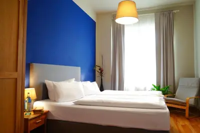 Ein Bett oder Betten in einem Zimmer der Unterkunft Aparthotel Mitte