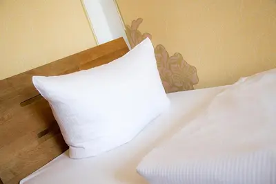 Ein Bett oder Betten in einem Zimmer der Unterkunft Aparthotel Mitte