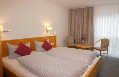 Ein Bett oder Betten in einem Zimmer der Unterkunft Pension Arcade