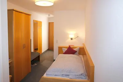 Ein Bett oder Betten in einem Zimmer der Unterkunft Pension Arcade