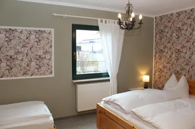 Ein Bett oder Betten in einem Zimmer der Unterkunft Ferienwohnung Muelenz