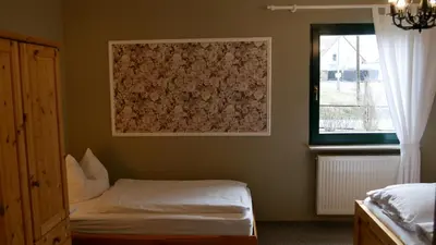 Ein Bett oder Betten in einem Zimmer der Unterkunft Ferienwohnung Muelenz
