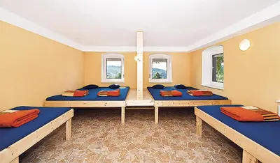 Ein Bett oder Betten in einem Zimmer der Unterkunft Bergoase Hütte und Hostel Sauna Kamin Lagerfeuer