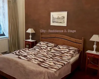 Ein Bett oder Betten in einem Zimmer der Unterkunft City-Ferienwohnungen-Dresden - zentral gelegen im Haus Louisenstrasse 11 - Dresden-Neustadt
