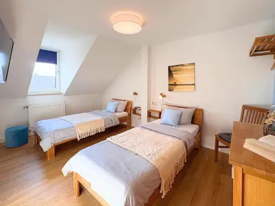 Ein Bett oder Betten in einem Zimmer der Unterkunft Ferienhaus Landeskrone für 10 Personen mit Sauna, Terrasse, inkl Parkplatz in Dresden