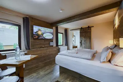 Ein Bett oder Betten in einem Zimmer der Unterkunft Sennerhütte Landhotel