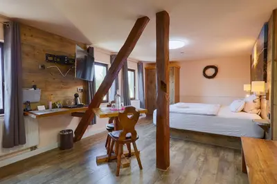 Ein Bett oder Betten in einem Zimmer der Unterkunft Sennerhütte Landhotel