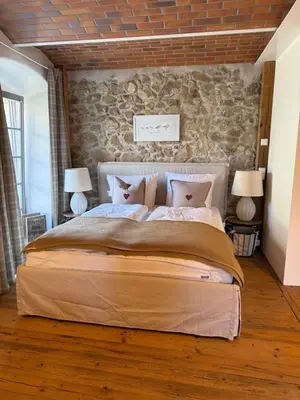 Ein Bett oder Betten in einem Zimmer der Unterkunft Landgut Mosch