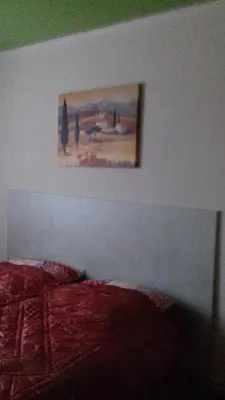 Ein Bett oder Betten in einem Zimmer der Unterkunft Pension Rosenvilla