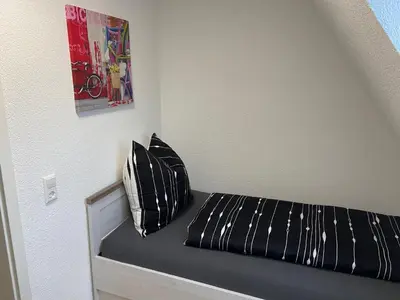 Ein Bett oder Betten in einem Zimmer der Unterkunft Gästehaus Graupner-Mittweida
