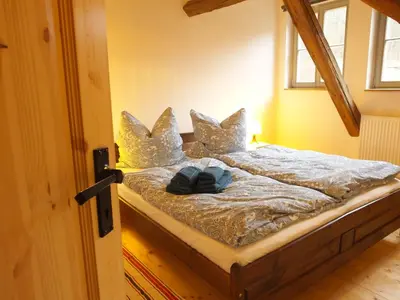 Ein Bett oder Betten in einem Zimmer der Unterkunft “Mägdestube” - Hammergut Neidberg