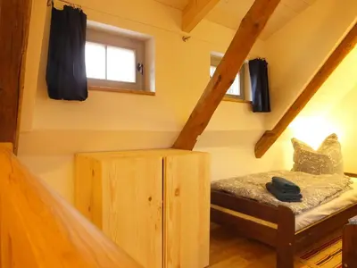 Ein Bett oder Betten in einem Zimmer der Unterkunft “Mägdestube” - Hammergut Neidberg