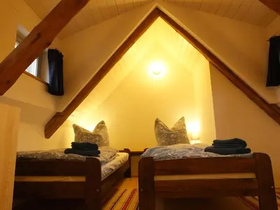 Ein Bett oder Betten in einem Zimmer der Unterkunft “Mägdestube” - Hammergut Neidberg