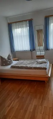 Ein Bett oder Betten in einem Zimmer der Unterkunft Pension Sorrento