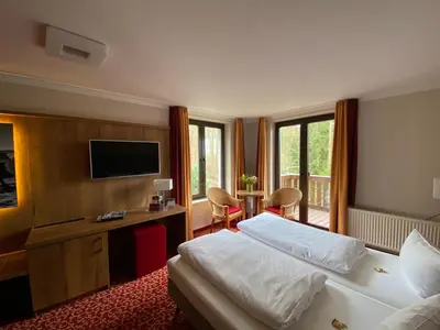 Ein Bett oder Betten in einem Zimmer der Unterkunft Parkhotel Margaretenhof