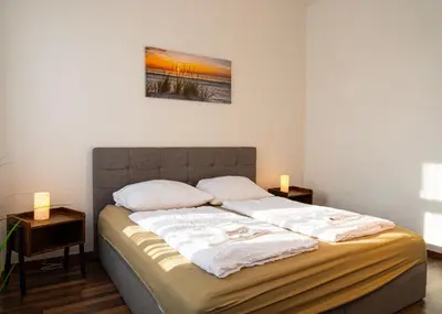 Ein Bett oder Betten in einem Zimmer der Unterkunft Apartmenthaus Rankestraße 4