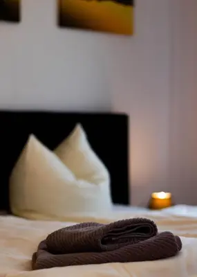 Ein Bett oder Betten in einem Zimmer der Unterkunft Apartmenthaus Rankestraße 4