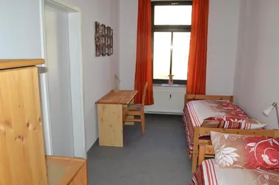 Ein Bett oder Betten in einem Zimmer der Unterkunft AA-Apartment -7 Wohnungen für Geschäftsreisende - wie zu Hause