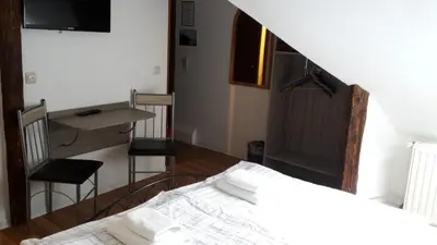 Ein Bett oder Betten in einem Zimmer der Unterkunft Pension Zentrum Riesa