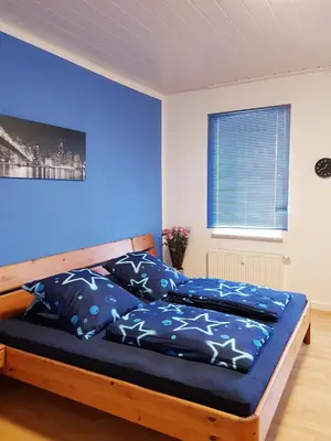 Ein Bett oder Betten in einem Zimmer der Unterkunft Ferienwohnung Hesse