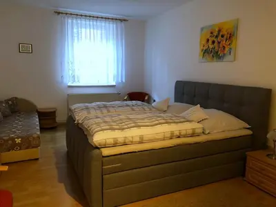 Ein Bett oder Betten in einem Zimmer der Unterkunft Ferienwohnung Buschbeck