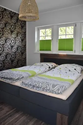Ein Bett oder Betten in einem Zimmer der Unterkunft Bahnhof Laussnitz
