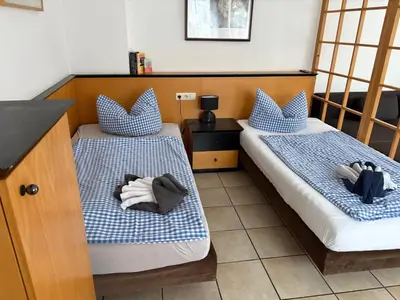 Ein Bett oder Betten in einem Zimmer der Unterkunft Apartmenthaus Home24