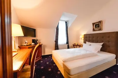 Ein Bett oder Betten in einem Zimmer der Unterkunft Historische Spitzgrundmühle