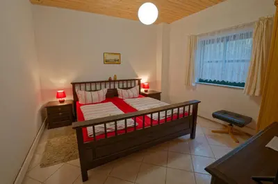 Ein Bett oder Betten in einem Zimmer der Unterkunft Ferienwohnung UHU neben der Schrammsteinbaude