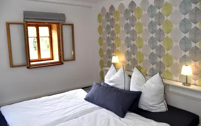 Ein Bett oder Betten in einem Zimmer der Unterkunft Urlaub im 200 Jahre alten Fachwerkhaus