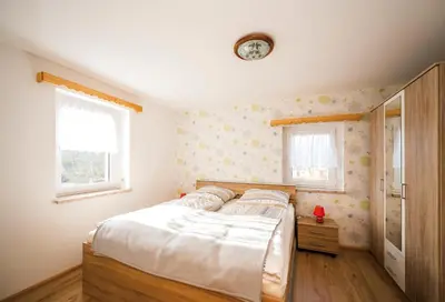 Ein Bett oder Betten in einem Zimmer der Unterkunft Ferienwohnung am Bauernhof