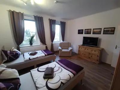 Ein Bett oder Betten in einem Zimmer der Unterkunft Ferienwohnungen Familie Winter