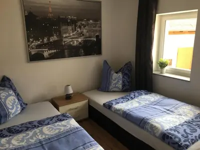 Ein Bett oder Betten in einem Zimmer der Unterkunft FeWo Altwahnsdorf