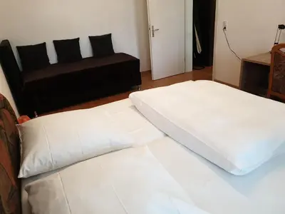 Ein Bett oder Betten in einem Zimmer der Unterkunft Avenue Apartment - Hilbersdorfer Straße