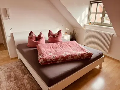 Ein Bett oder Betten in einem Zimmer der Unterkunft KM - Altstadtapartments Freiberg