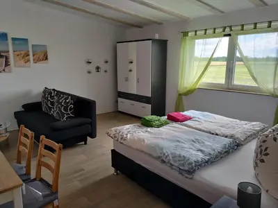 Ein Bett oder Betten in einem Zimmer der Unterkunft Ferienwohnung Oertel - [#121787]