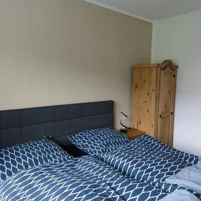Ein Bett oder Betten in einem Zimmer der Unterkunft Galloway Hof Wantewitz