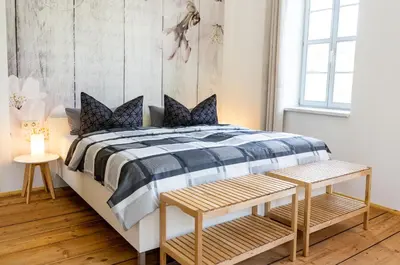 Ein Bett oder Betten in einem Zimmer der Unterkunft Ferienwohnungen im Gasthaus Zur Grünen Wiese