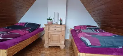 Ein Bett oder Betten in einem Zimmer der Unterkunft Ferienwohnung Meierbaude