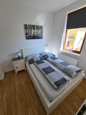 Ein Bett oder Betten in einem Zimmer der Unterkunft Ferienwohnung Muldental