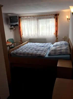 Ein Bett oder Betten in einem Zimmer der Unterkunft Landhotel Quelle