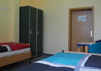 Ein Bett oder Betten in einem Zimmer der Unterkunft Hostel jo-si