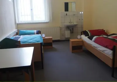 Ein Bett oder Betten in einem Zimmer der Unterkunft Hostel jo-si