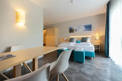 Ein Bett oder Betten in einem Zimmer der Unterkunft Riff Resort