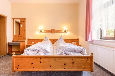 Ein Bett oder Betten in einem Zimmer der Unterkunft Hotel Carola