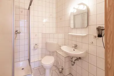 Ein Badezimmer in der Unterkunft Hotel Carola