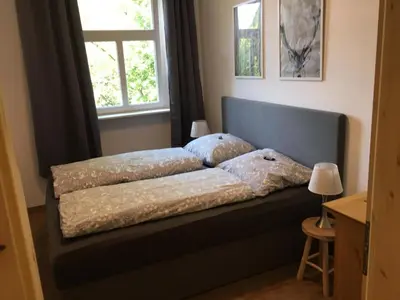 Ein Bett oder Betten in einem Zimmer der Unterkunft Ferienwohnungen Schweizerhaus