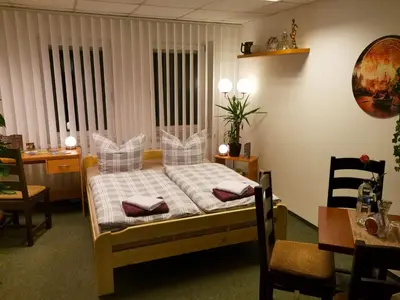 Ein Bett oder Betten in einem Zimmer der Unterkunft Gästezimmer Am Gewölbekeller