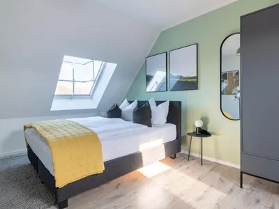 Ein Bett oder Betten in einem Zimmer der Unterkunft Limehome Chemnitz Hartmannstraße