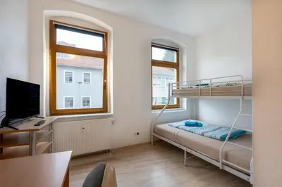 Ein Bett oder Betten in einem Zimmer der Unterkunft Wohnen in 09599 Freiberg